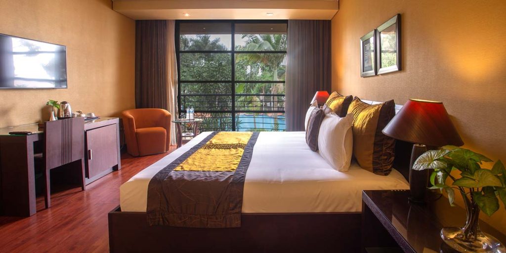 Speke resort munyonyo executive room bed and balcony